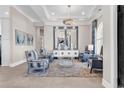 Living room with elegant decor, including mirrored wall decor and stylish furnishings at 9407 Venezia Circle, Myrtle Beach, SC 29579