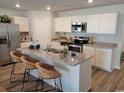 Modern kitchen with stainless steel appliances, granite countertops, and island seating at 985 Cherrystone Loop, Conway, SC 29526