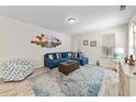 Bright living room with coastal decor, nice furnishings, and a comfortable blue sectional sofa at 2250 Heritage Loop, Myrtle Beach, SC 29577