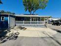 Blue beach house exterior featuring a spacious driveway at 6001 - 1599 S Kings Hwy., Myrtle Beach, SC 29575