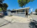 Blue beach house exterior featuring a spacious driveway at 6001 - 1599 S Kings Hwy., Myrtle Beach, SC 29575