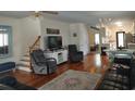 Inviting living room boasts hardwood floors, comfortable seating, and open access to the kitchen at 69 Sea Level Loop, Pawleys Island, SC 29585