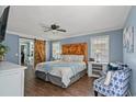 Serene main bedroom featuring a barn door to the bathroom and hardwood floors at 1021 Myrtle Dr., Surfside Beach, SC 29575