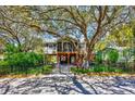 Beautiful home with large trees in the front yard and a screened porch at 4520 Hedrick St., North Myrtle Beach, SC 29582