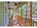 Relaxing screened porch with wooden floors and ceiling fan at 4520 Hedrick St., North Myrtle Beach, SC 29582