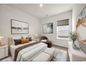 Inviting bedroom with natural light, a plush bed, and stylish decor for a relaxing retreat at 476 Honeyhill Loop, Conway, SC 29526