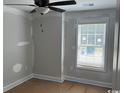 Bedroom with natural light, ceiling fan, and neutral paint at 8054 Mill Pond Rd., Galivants Ferry, SC 29544