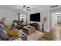 Comfortable living room featuring modern furniture, a large TV, and a ceiling fan at 10301 N Kings Hwy. # 8-1, Myrtle Beach, SC 29572