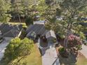 Aerial shot of home with mature trees and a pond in a serene setting at 111 Cedar Ridge Ln., Conway, SC 29526