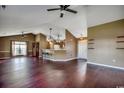 Spacious living room with hardwood floors, ceiling fans, and open access to the kitchen at 1154 Lampwick Ln., Murrells Inlet, SC 29576