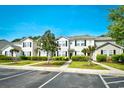 Neat condo exteriors with landscaped yards and dedicated parking spaces at 121 Olde Towne Way # 2, Myrtle Beach, SC 29588
