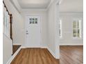 Inviting entryway with wood-look flooring and sidelight windows at 129 Old Cedar Loop, Pawleys Island, SC 29585