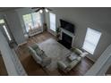 Aerial view of a living room with fireplace, two recliners, and ample natural light at 2039 Chadbury Ln., Myrtle Beach, SC 29588