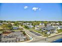 An aerial view showcasing the neighborhood, nearby houses, and parking lot at 2101 S Ocean Blvd. S # B-6, North Myrtle Beach, SC 29582