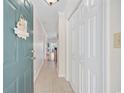 Bright entryway features tile flooring, coat closet, and 