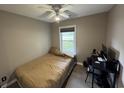 Cozy bedroom with a twin bed, desk, and a window providing natural light for a comfortable living space at 342 Red Fox Rd., Myrtle Beach, SC 29579