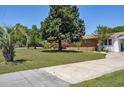 Lovely brick home with a spacious front yard featuring mature trees and an expansive driveway at 4196 E Highway 319, Conway, SC 29526