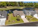 Stunning aerial view of a home backing onto a pond and the golf course at 4325 Deer Run Ave., Little River, SC 29566