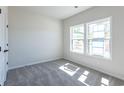 Bright bedroom with large windows and neutral carpeting at 549 Honeyhill Loop, Conway, SC 29526