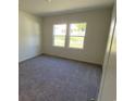 Cozy bedroom with soft carpeting and a window providing natural light at 605 Muster Field Ct., Conway, SC 29526