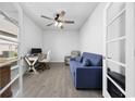 Inviting living space with a blue sofa, ceiling fan, and neutral decor, offering comfort and style at 6562 Torino Lane, Myrtle Beach, SC 29572