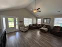 Bright, open living room featuring vaulted ceilings, hardwood floors, and comfortable seating at 7370 Johnson Shortcut Rd., Conway, SC 29527
