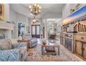 Spacious living area with open floor plan and luxurious furnishings, bathed in light at 7470 Seville Dr., Myrtle Beach, SC 29572