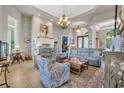 Open-concept living room boasting a fireplace, plush seating, and elegant decor at 7470 Seville Dr., Myrtle Beach, SC 29572