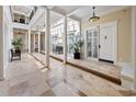 Bright hallway with marble floors, columns, and natural light at 815 Front St. # 2-H, Georgetown, SC 29440