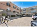 View of a parking area with multiple cars and buildings at 815 Front St. # 2-H, Georgetown, SC 29440