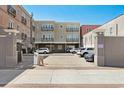 View of a parking area with multiple cars and buildings at 815 Front St. # 2-H, Georgetown, SC 29440