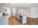 Contemporary kitchen showcasing an island with a sink and modern appliances, with gray cabinets at 993 Cherrystone Loop, Conway, SC 29526