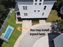 An overhead shot showcases the home's exterior and an area where a pool could be installed at 108 Tidal Creek Dr., Garden City Beach, SC 29576