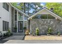 Charming entrance with stone accents, ample natural light, and well-maintained landscaping at 1646 Bay Tree Ln., Surfside Beach, SC 29575