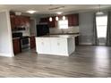 Modern kitchen with stainless steel appliances, white island, and granite countertops at 212 Weyburn St., Myrtle Beach, SC 29579