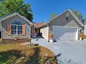 Beautiful home with attached garage, featuring a well-kept lawn and neutral exterior at 2488 Oriole Dr., Murrells Inlet, SC 29576
