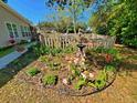 Charming garden area with a variety of flowers, plants, and a small bird bath at 2488 Oriole Dr., Murrells Inlet, SC 29576