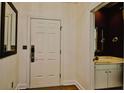 Entryway with a paneled door leading to a half bath at 273 Golden Bear Dr. # F3, Pawleys Island, SC 29585