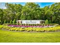 Pawleys Plantation Golf and Country Club sign amidst colorful flower beds at 273 Golden Bear Dr. # F3, Pawleys Island, SC 29585