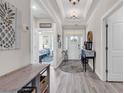 Bright entry hall showcasing stylish decor, natural light, and a glimpse of the home's layout at 296 Switchgrass Loop, Little River, SC 29566