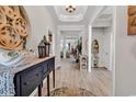 Inviting foyer with elegant details, decorative console table, and a view into the spacious living areas at 296 Switchgrass Loop, Little River, SC 29566