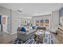 Bright and inviting living room with large windows, plush seating, and contemporary design elements at 3316 Bay View Ct., North Myrtle Beach, SC 29582