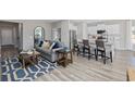 Open-concept living room featuring modern furnishings, including a comfortable sofa and stylish decor at 3316 Bay View Ct., North Myrtle Beach, SC 29582