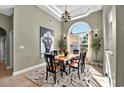 Elegant dining room featuring large arched window and stylish chandelier at 4016 Atalaya Pl., Myrtle Beach, SC 29579