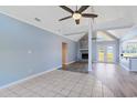 Open-concept living room with vaulted ceilings, fireplace, and transitions to the kitchen at 584 Circle Dr., Surfside Beach, SC 29575