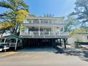 Inviting home with double decks, ceiling fans, and ample covered parking at 6001 - 1322 S Kings Hwy., Myrtle Beach, SC 29575