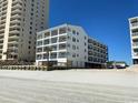 Beachfront condo with multiple balconies offering stunning ocean views at 920 N Waccamaw Dr. # 2-304, Murrells Inlet, SC 29576