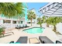 Inviting backyard with private pool and lounge chairs for relaxing and entertaining at 1010B S Ocean Blvd., Surfside Beach, SC 29575