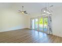 Spacious living room offers wood floors, vaulted ceilings, and natural light at 105 Villa Mar Dr. # C-1, Myrtle Beach, SC 29579