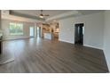 Spacious living room with hardwood floors, a ceiling fan, and an open floor plan at 1051 Laconic Dr., Myrtle Beach, SC 29588